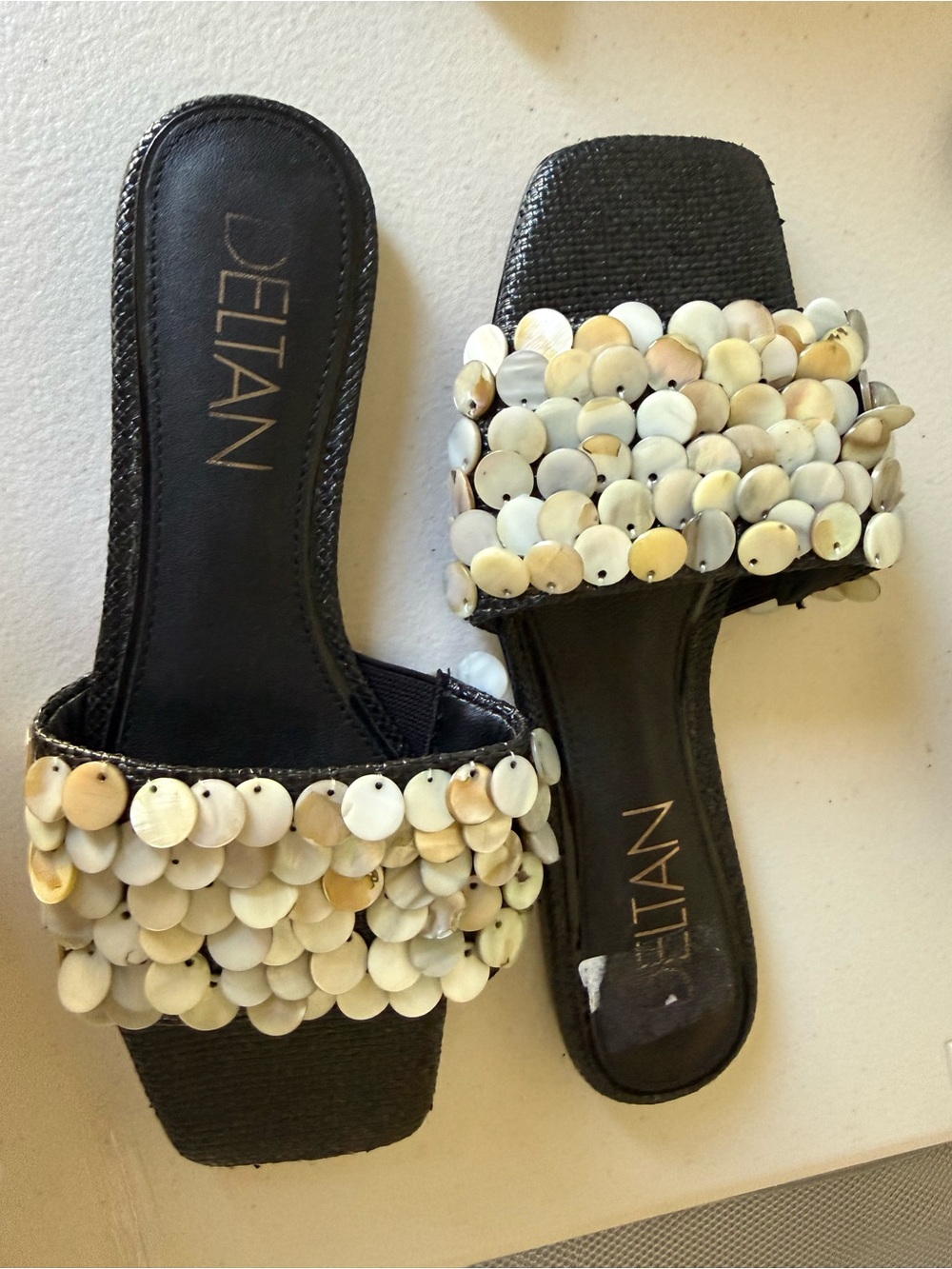 Delta Black Slide Mules with Mother-of-Pearl Disc Embellishments